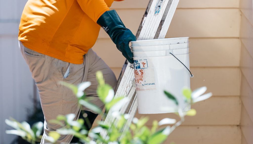 ladder and bucket for gutter cleaning